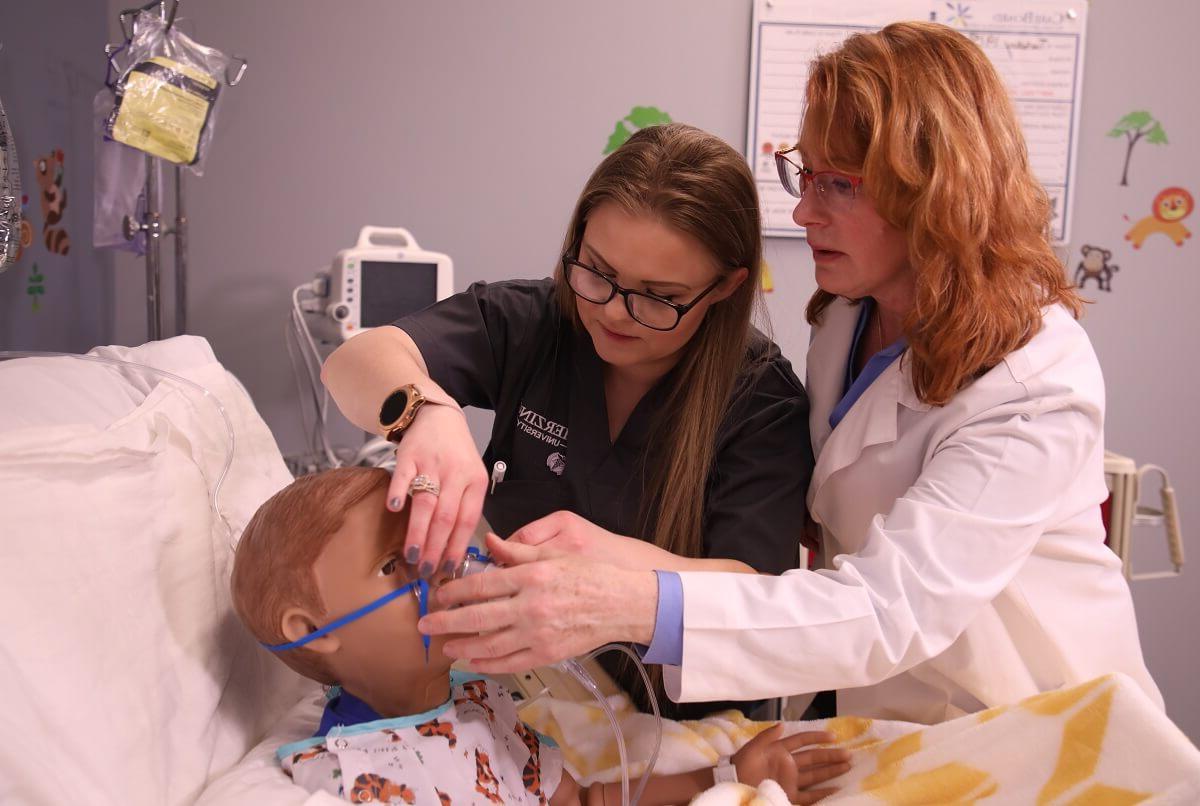 LPN to RN Nursing Student with Teacher Learning How to Apply Oxygen Mask